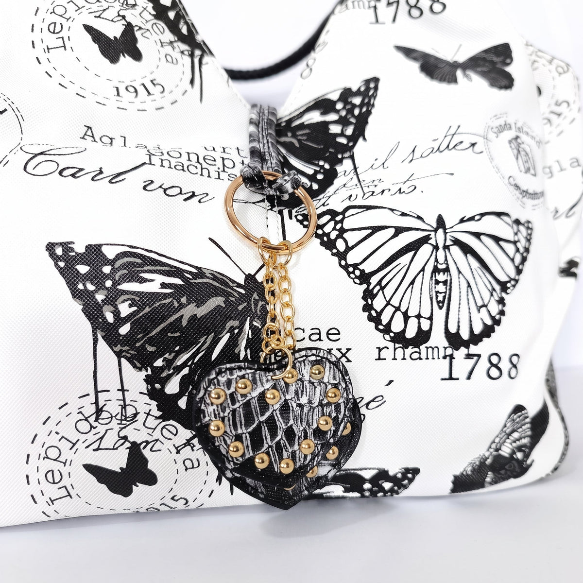Adelina Borsa a Mano in Canvas Farfalle