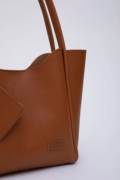 Tan SHK108 faux leather women hand and shoulder with wallet and makeup